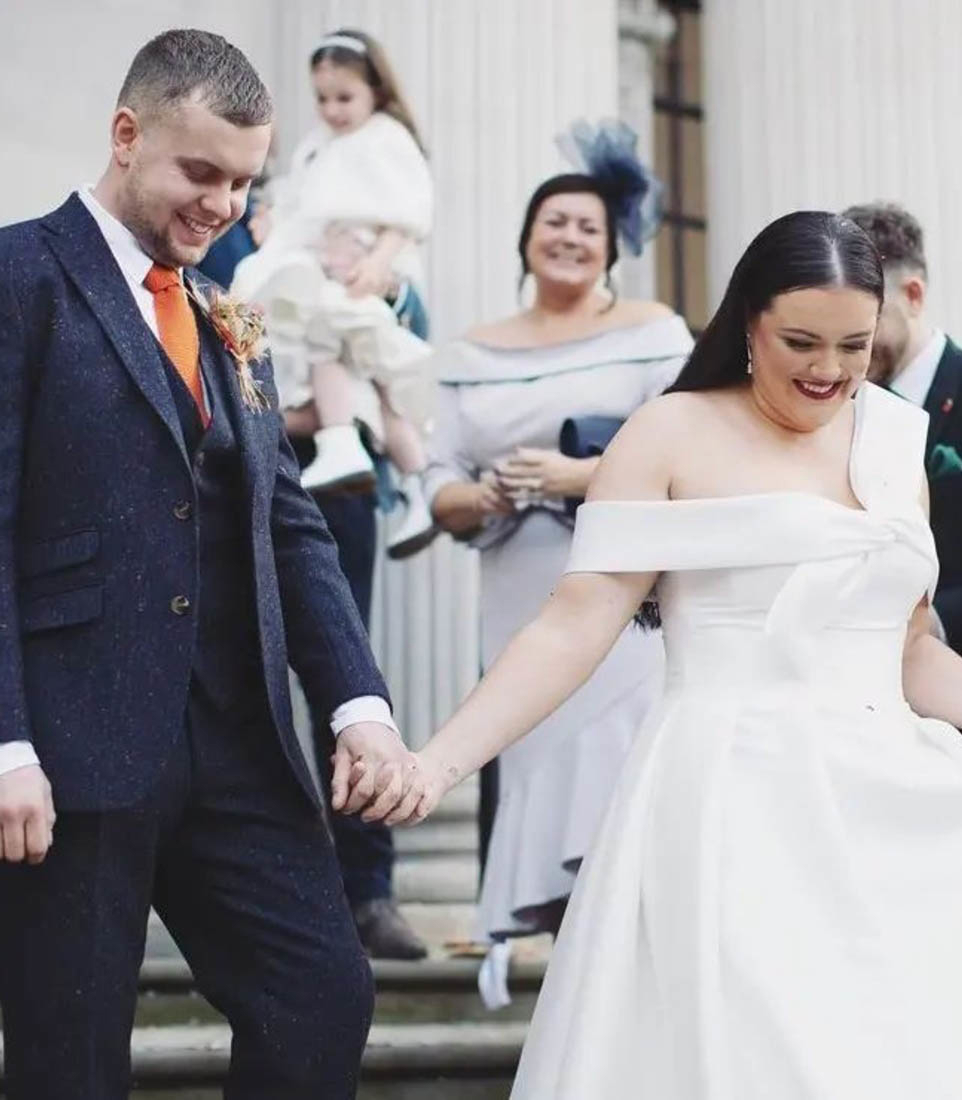 Photo of the smiling real bride couple