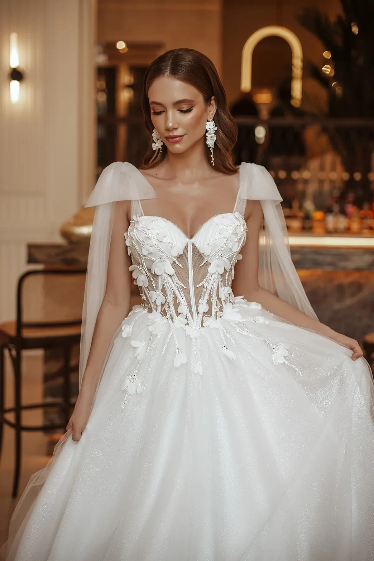 Bridal gown with 3D floral appliques