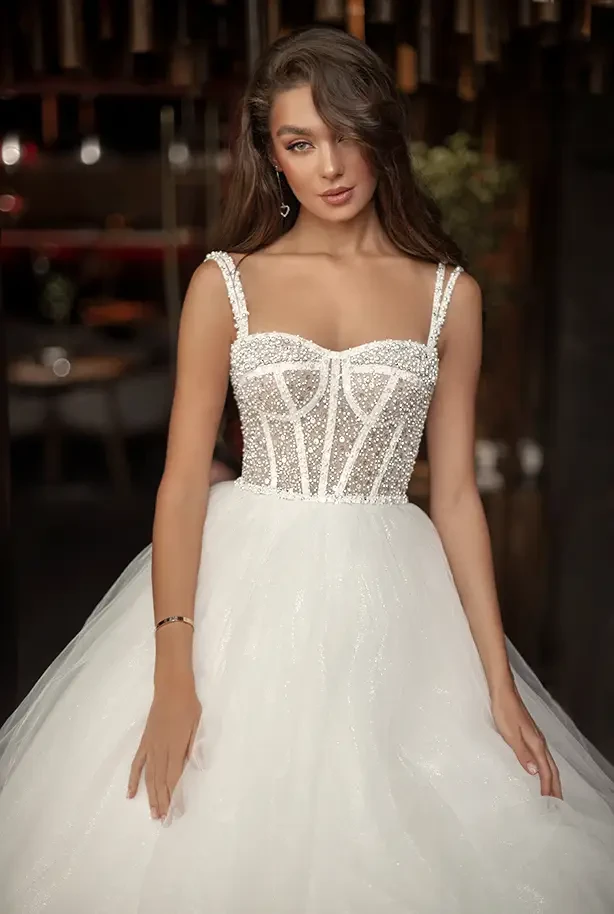 Bridal gown with straps and beading